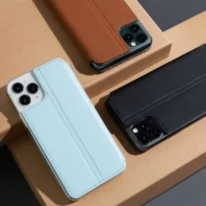 Twelve South SurfacePad iPhone 11 Pro Max-läderfodral i blått, brunt och svart på kartonger