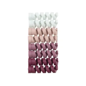 Bluelounge CableCoil Mini kabelskydd i 9-pack i ombrérosa, visas som staplade spiralhöljen