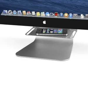 Estante tras la pantalla Twelve South BackPack 3 para iMac, con un smartphone sobre una bandeja plateada
