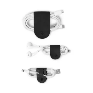 Organizadores de cables CableSnap de cuero negro de Twelve South con cables USB y de auriculares enrollados