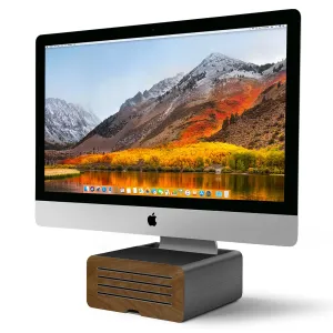 Twelve South HiRise Pro soporte para iMac con compartimento de almacenamiento oculto y panel frontal de madera, que sostiene un iMac plateado