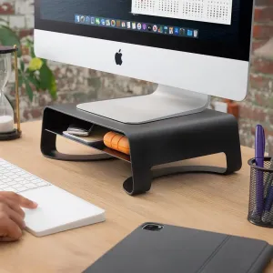 Soporte negro para monitor Twelve South Curve Riser con estante de almacenamiento, que sostiene un iMac sobre un escritorio