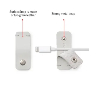 Twelve South CableSnap Stay-kabelorganisatör i läder i duvgrått med tryckknapp i metall och fastsatt laddningskabel