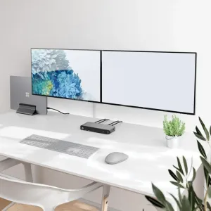 Station d’accueil universelle ALOGIC PRIME MX2 sur un bureau, avec des câbles USB-C connectés et deux moniteurs dans un espace de travail épuré