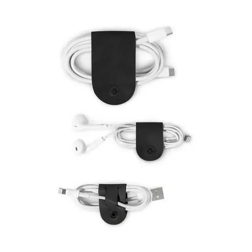 Organizadores de cables CableSnap de cuero negro de Twelve South con cables USB y de auriculares enrollados