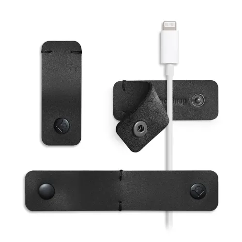 Twelve South CableSnap Stay kabelhanteringsremmar i läder med tryckknappar och vit laddningskabel