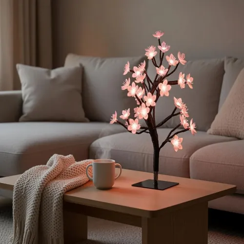 Lite Bulb Moments smart kirsebærblomst-trælampe, der lyser pink, på sort base til stemningsbelysning i stuen